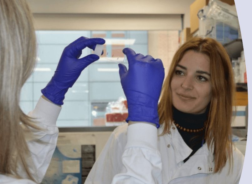 Photo of two scientists with a sample