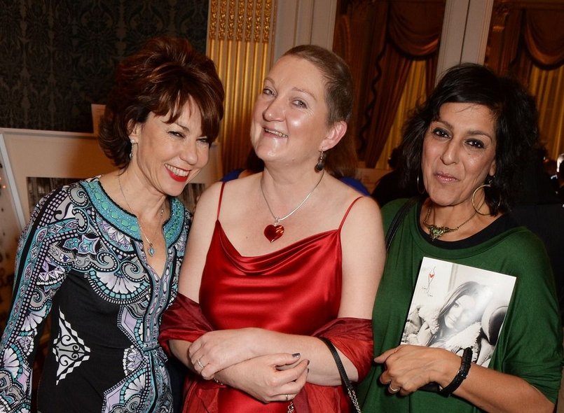 Image of Daloni Carlisle in the centre with two people smiling either side