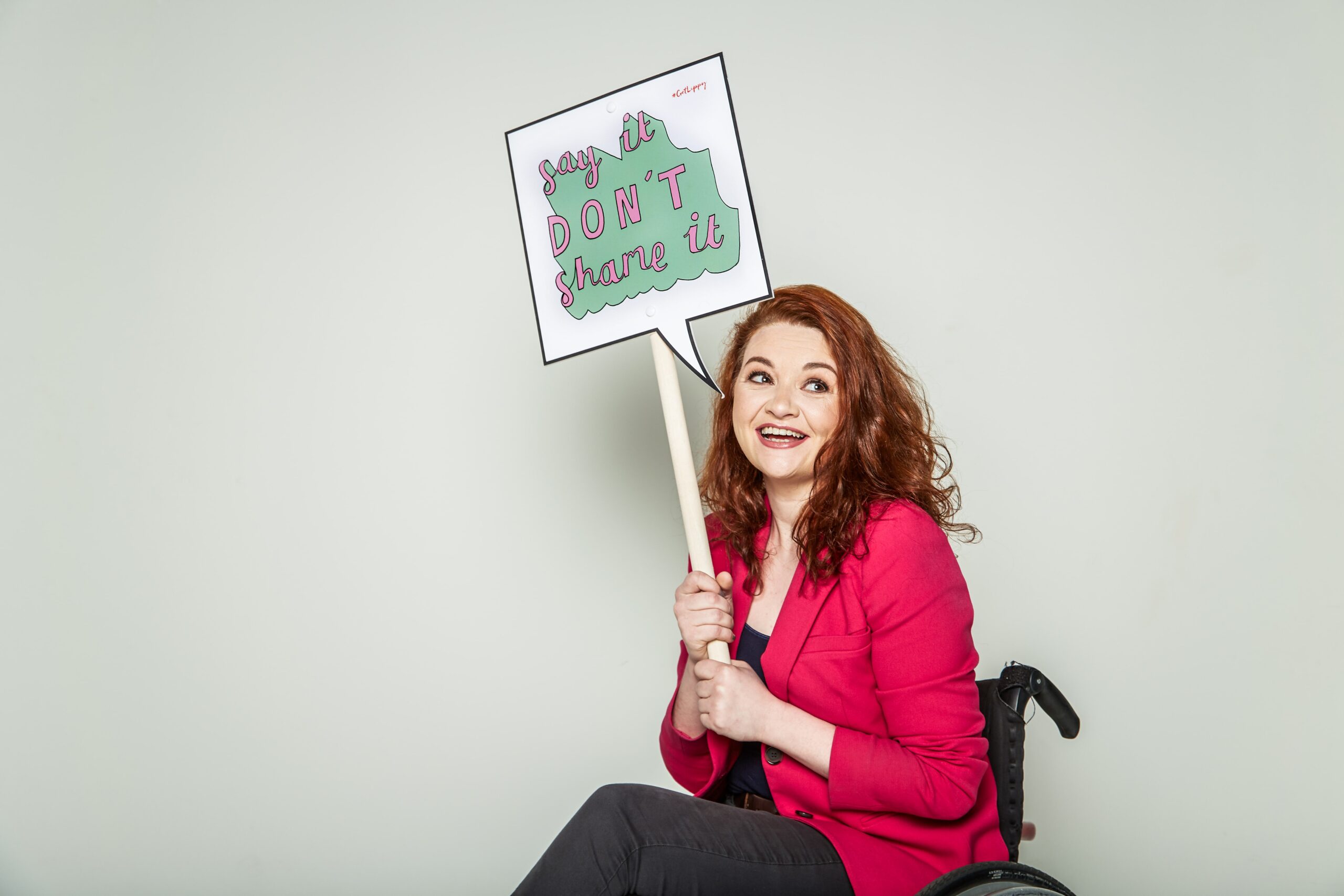Dr Hannah Barham Brown holding a sign saying know your normal