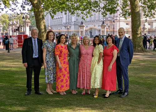 photo of Mike, with Team Eve outside Buckingham Palace