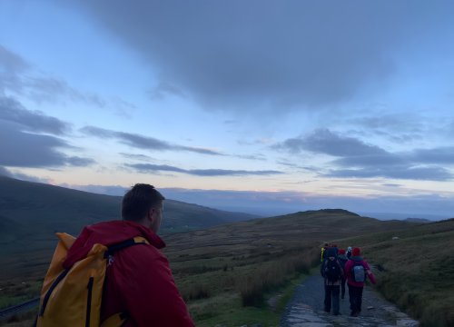 image of Eve appeal supporters trekking Snowdon at night